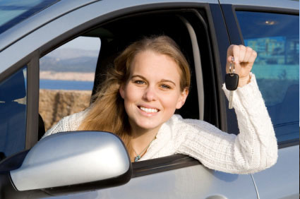 happy woman with car keys